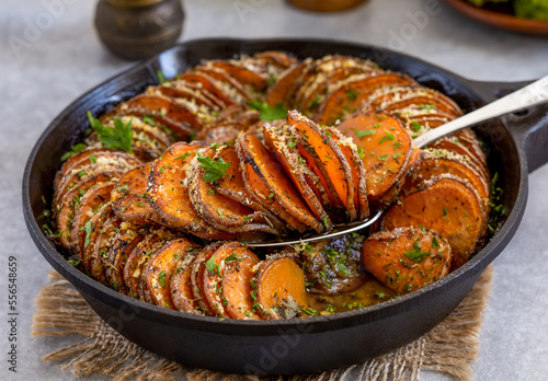 Photography Roasted sweet potato parmesan gratin in a cast iron skillet