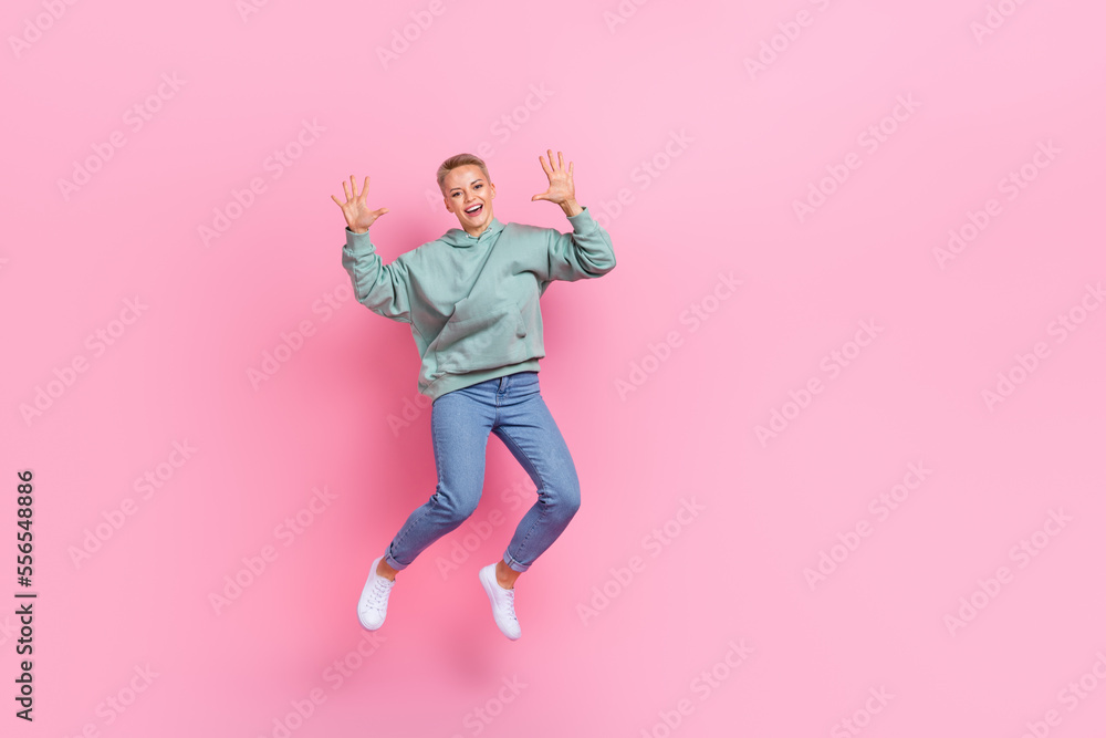 Photo of cheerful pretty glad lady wear stylish clothes good mood demonstrate palms empty space isolated on pink color background Photo of cheerful pretty glad lady wear stylish clothes good mood demonstrate palms empty space isolated on pink color background