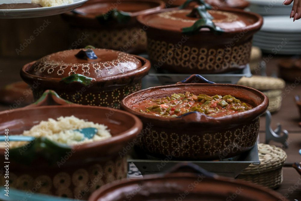 Fototapeta premium typical clay pot for buffet of traditional mexican food in Mexico