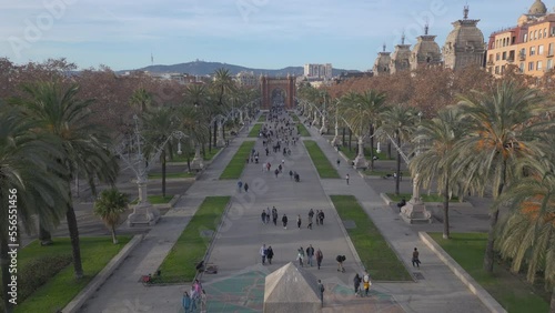 view of Passeig de Lluís Companys descending behind obelisk monument in Barcelona photo