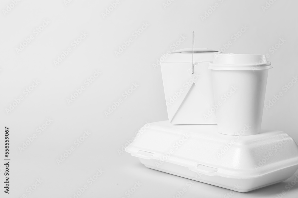 Food containers and paper cup on light background Food containers and paper cup on light background