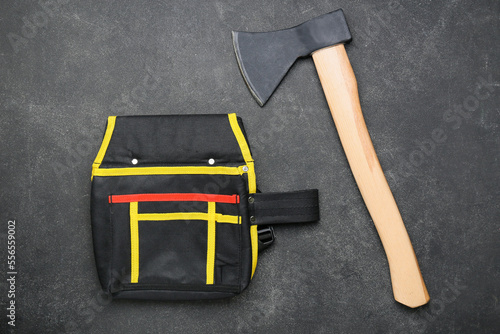 Ax and tools bag on dark ba...