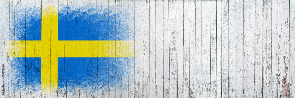 Flag of Sweden. Flag is painted on a white wooden surface. Wooden background. Plywood surface. Copy space. Textured background Flag of Sweden. Flag is painted on a white wooden surface. Wooden background. Plywood surface. Copy space. Textured background