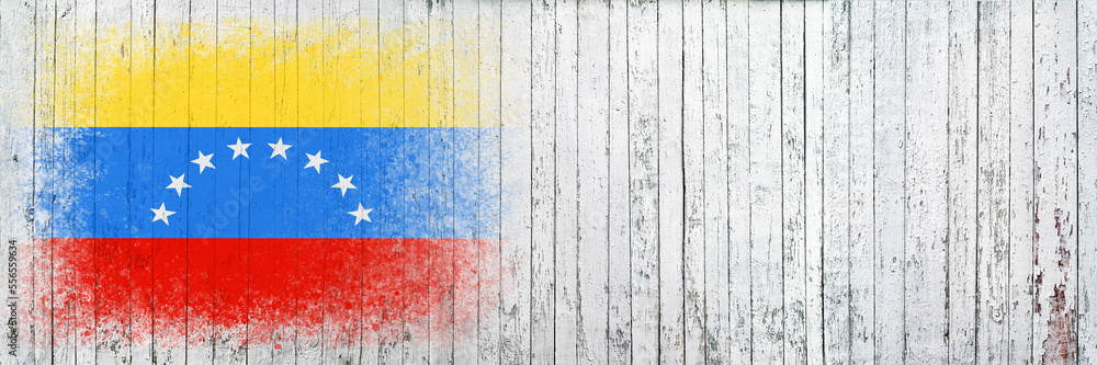 Flag of Venezuela. Flag is painted on a white wooden surface. Wooden background. Plywood surface. Copy space. Textured background