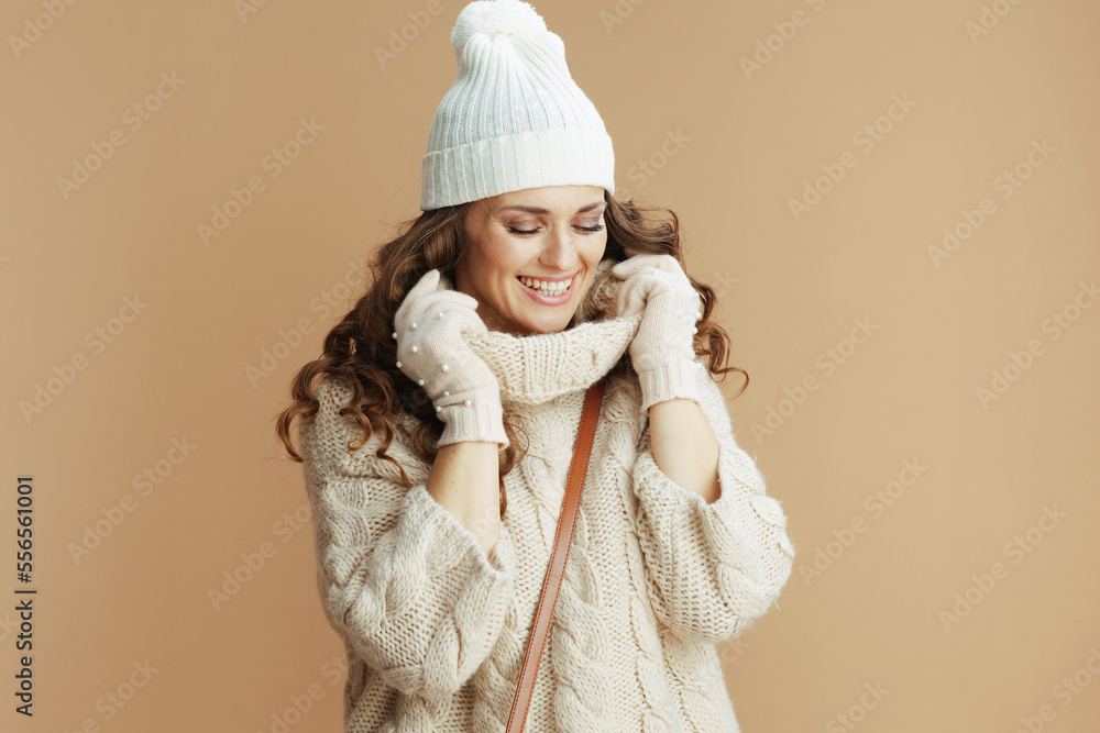smiling modern female wrapped in collar isolated on beige smiling modern female wrapped in collar isolated on beige