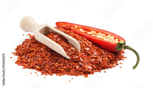 фотографія Heap of chipotle chili flakes and scoop on white background