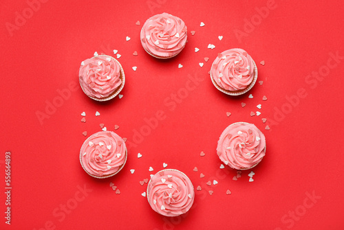 Pink frosted cupcakes with ...