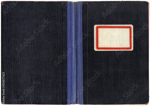 Vintage exercise book or notebook, open paper cover with canvas spine and empty label