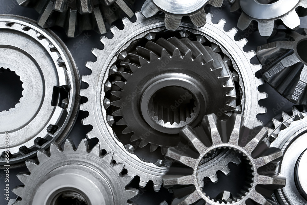 Many different stainless steel gears as background, top view Many different stainless steel gears as background, top view