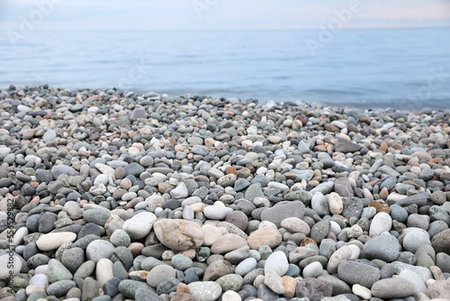 Picturesque view of beach with pebbles near sea