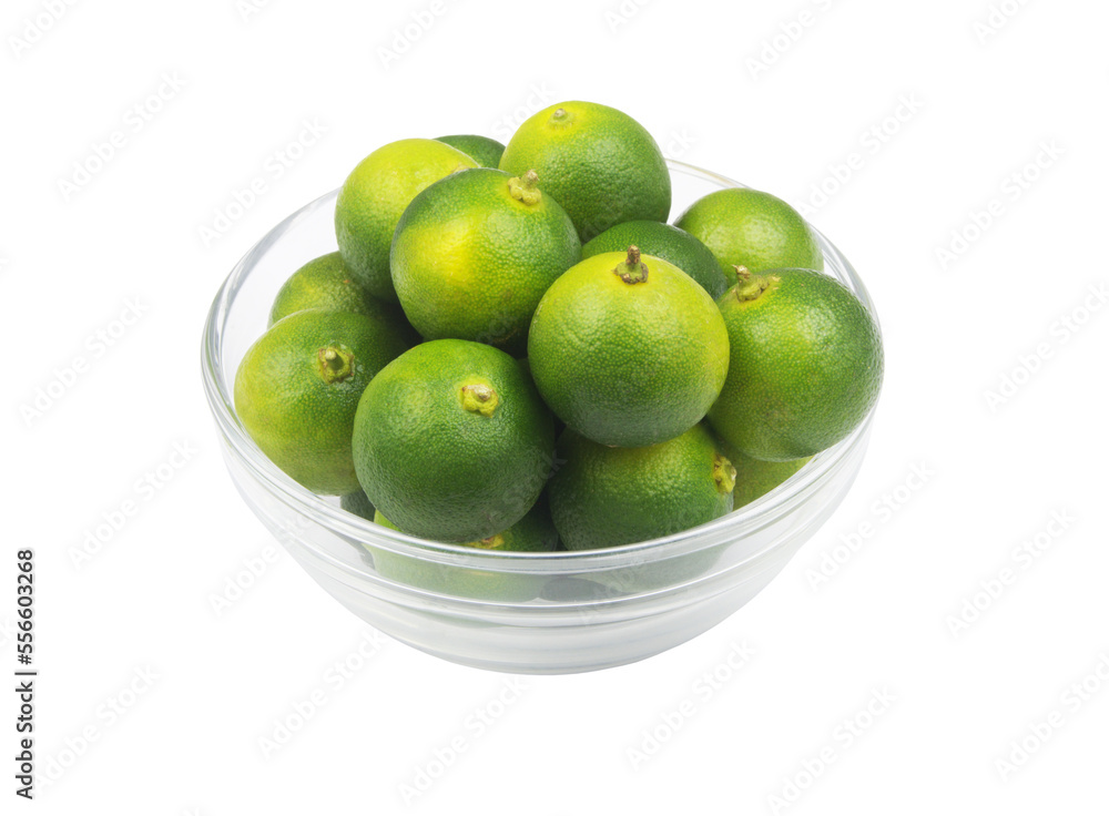 Fresh calamansi lime fruits in glass bowl isolated on white background. Fresh calamansi lime fruits in glass bowl isolated on white background.