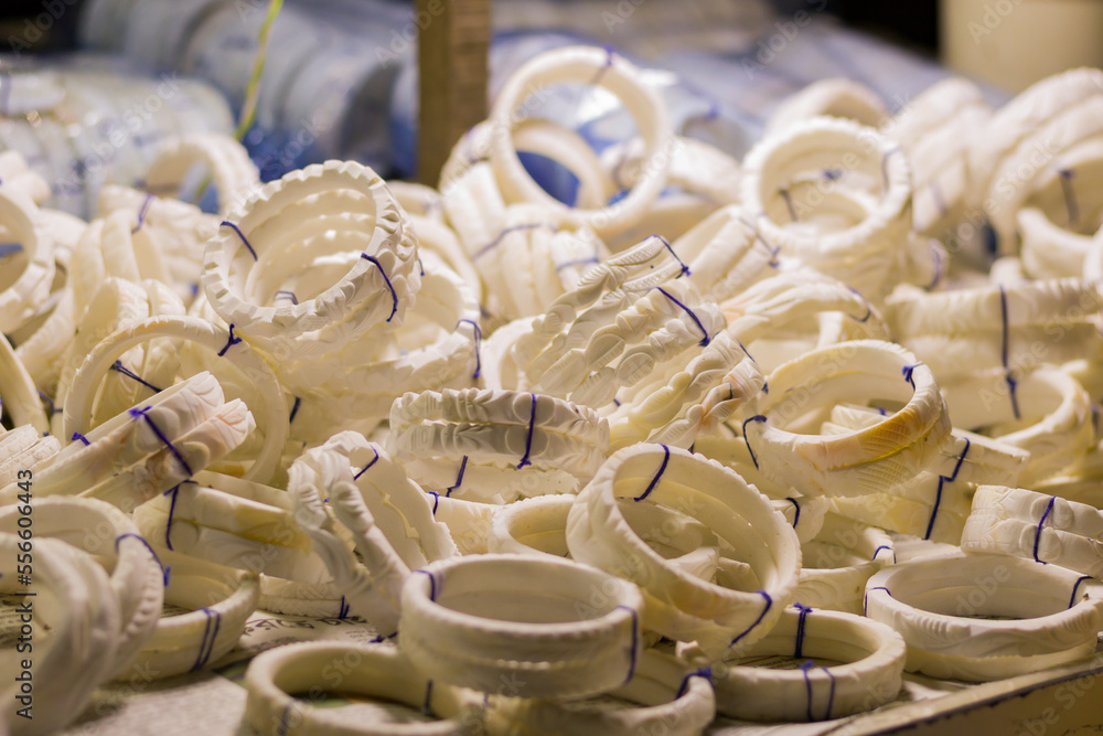 shankha or white bangles made of conch shells being sold near sea beach