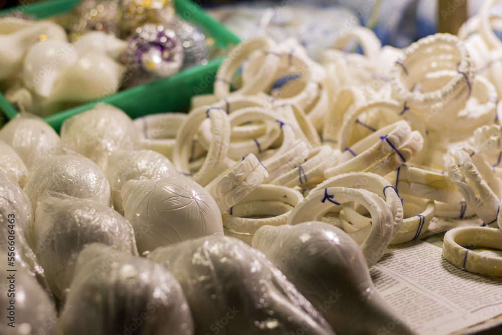 shankha or white bangles made of conch shells being sold near sea beach