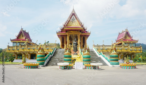 A Beautiful Church in a Buddhist Temple  Standing Buddha statue with The stairway to Wat Ban Ngao Temple  Wat Baan Ngaw   Ranong  Thailand of all Naga stairways to Buddhist temples in Thailand.