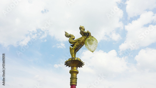 A Beautiful Kinnaree light pole at Wat Ban Ngao Temple (Wat Baan Ngaw), Ranong Province, Thailand. photo