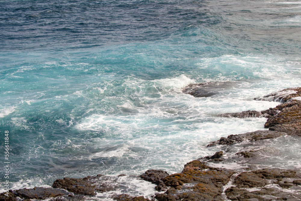 Rocky sea coast. Beautiful turquoise waters of the Sea. Ocean waves against the coastal rocks. Scenery view on ocean. Wonderful summer seascape. Rocky sea coast. Beautiful turquoise waters of the Sea. Ocean waves against the coastal rocks. Scenery view on ocean. Wonderful summer seascape.