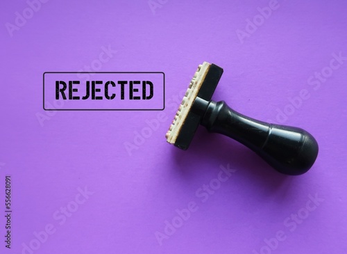 Photography Rubber stamp with stamp words REJECTED on purple background, means refuse to agr