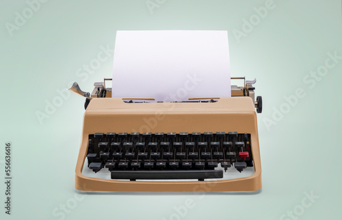 Vintage typewriter with blank paper