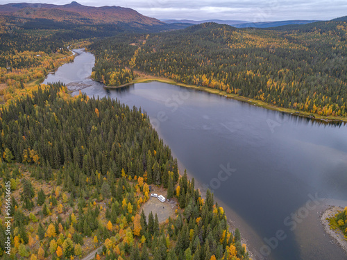 aerial view camping caravan near river autumn fall landscape along Ammarnas National Park in Lapland Sweden