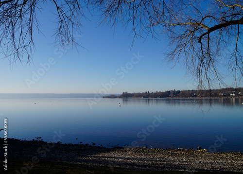 Canvas Print wintery peaceful scenery with lake Ammersee in Herrsching in Bavaria (Germany)