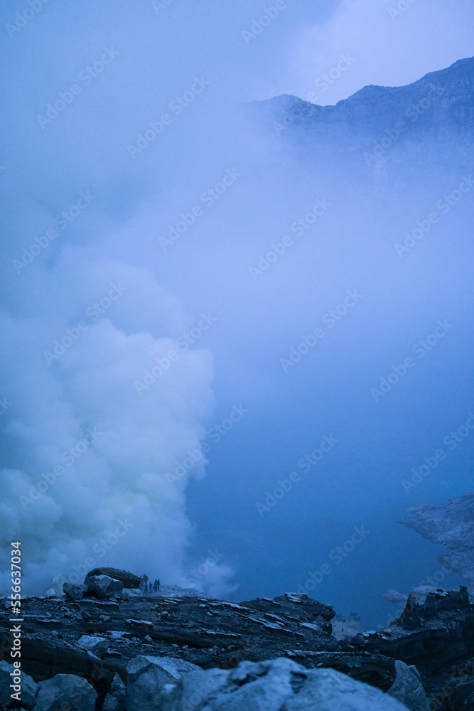 Fototapeta premium Mount Ijen Crater is a tourist spot that has a number of interesting panoramas such as blue fire and sunrise. Tourists can observe the activities of sulfur miners in extreme environments.