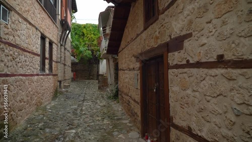 Medieval Looking Narrow Street in a picturesque Kyriotissa quarter with tall buildings photo