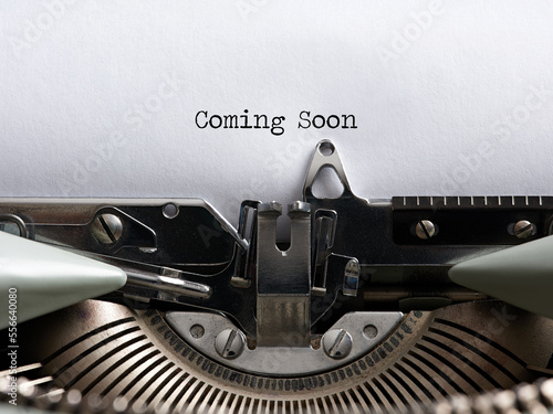 The announcement message coming soon written with a vintage typewriter. photo