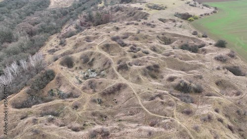 Steppe pits drone aerial limestone mine Kosirske lomy national nature reserve. Valuable botanical grass meadow landscape greater pasque flower Pulsatilla grandis hole stone rock orchids orchid photo