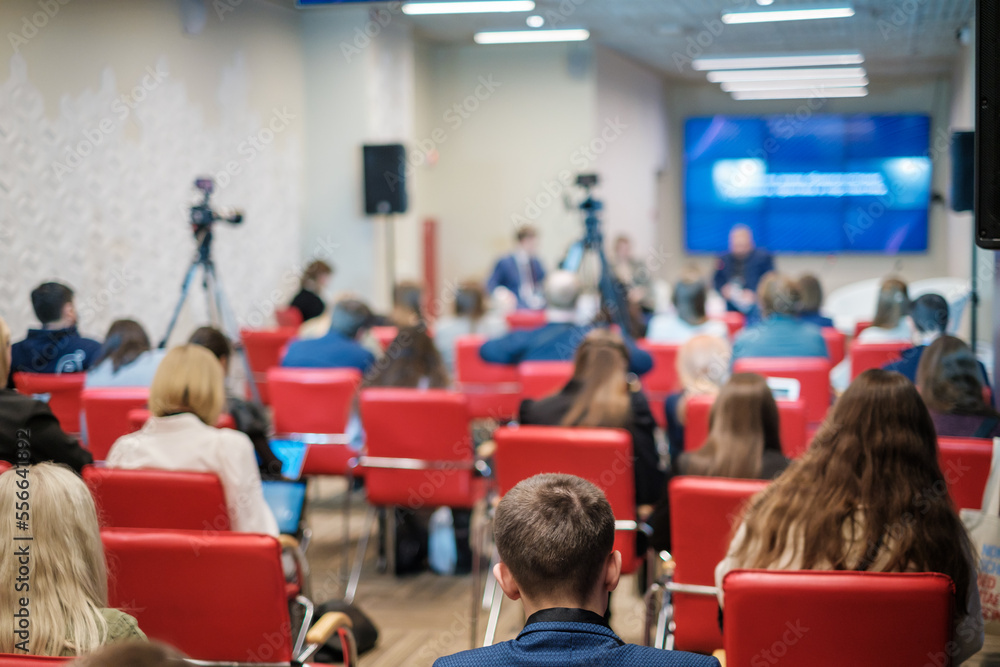 Crowd during business seminar in auditorium