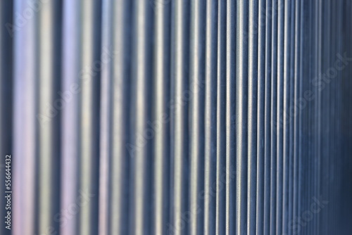 A blurred view to steel pipes in a row.