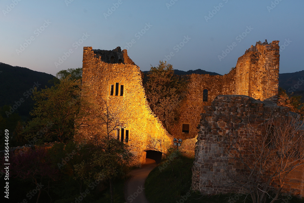 Night time falling over the stones of the castle at the too of the hill in Badenweiler, South Germany, near the Black Forest Night time falling over the stones of the castle at the too of the hill in Badenweiler, South Germany, near the Black Forest