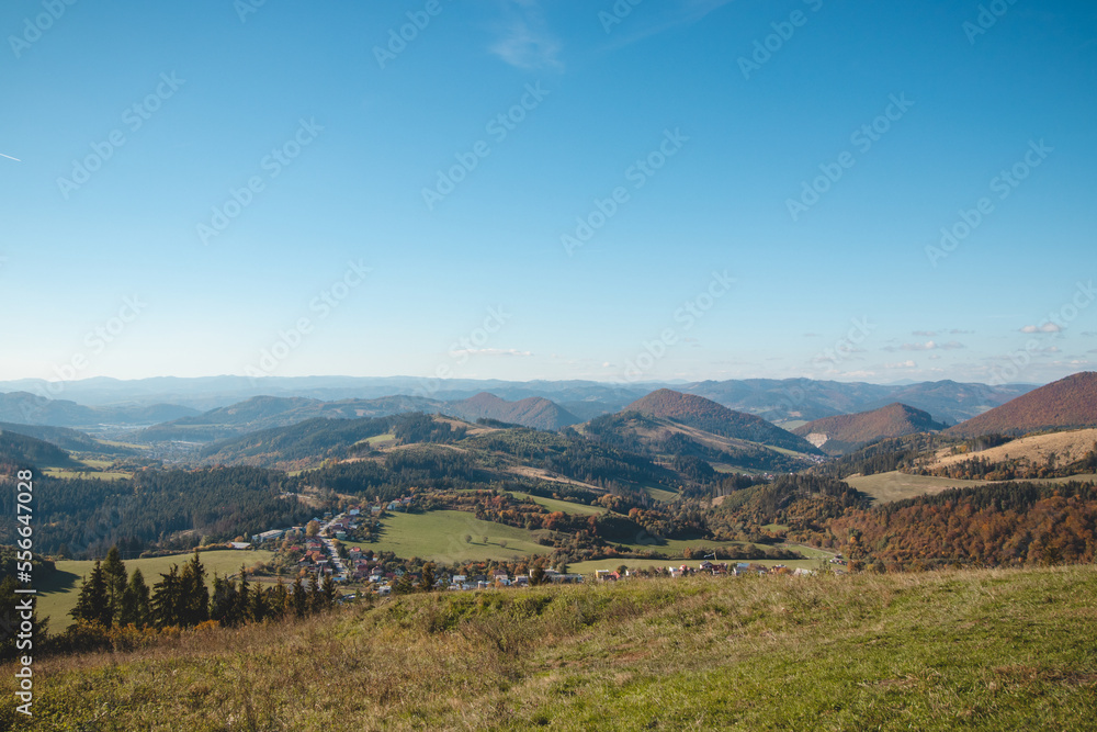 Viewpoint from mountain Stranik near Zilina, Slovakia. View of the valley and autumn coloured forests. Beautiful sunny day. Travelling in Eastern Europe