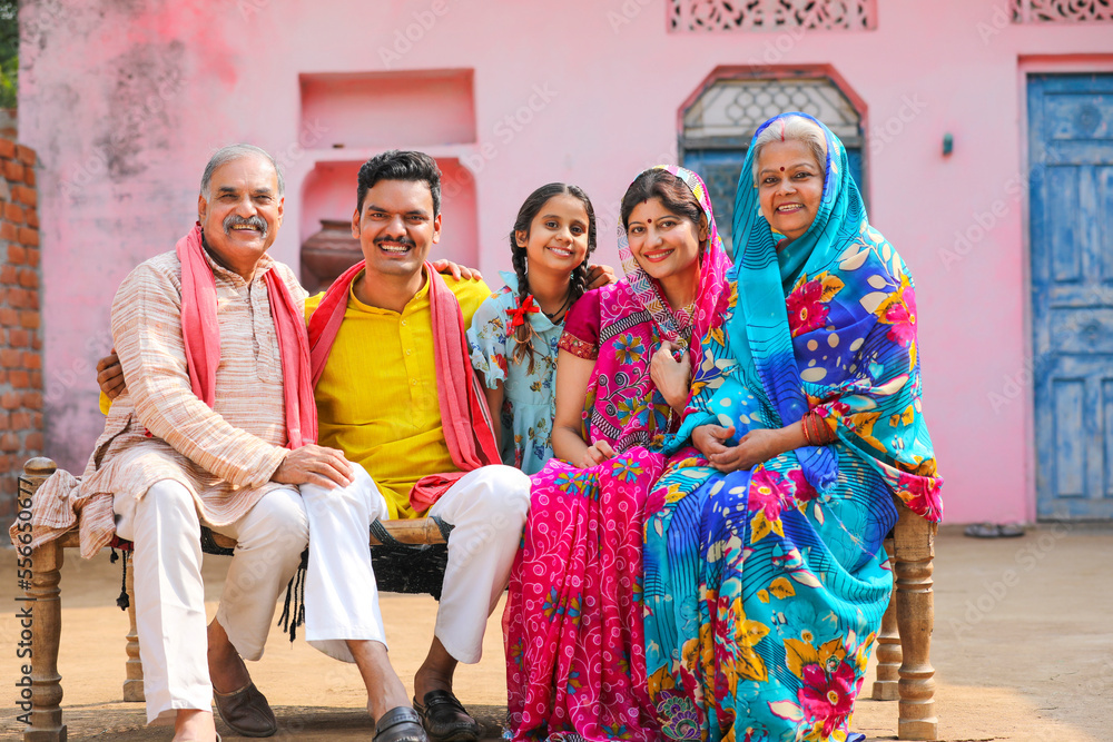 Happy Indian rural family setting at home.