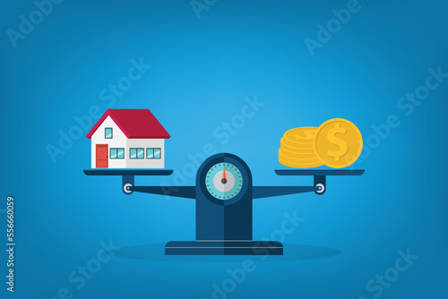 Investment in real estate. House, coins, weight scales.	