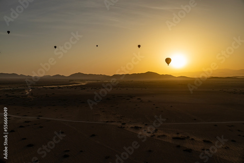 Sunrise with hot air balloons in the Atlas mountains