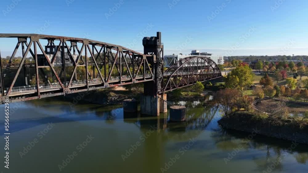 Bridge over Arkansas River in Little Rock. Clinton Presidential Library in distance. Aerial pullback reveal. Bridge over Arkansas River in Little Rock. Clinton Presidential Library in distance. Aerial pullback reveal.