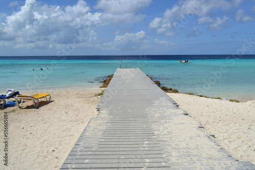 Fototapeta Naklejka Na Ścianę i Meble -  a beautiful wooden pier on a paradise beach on the island of Curacao in the caribbean sea