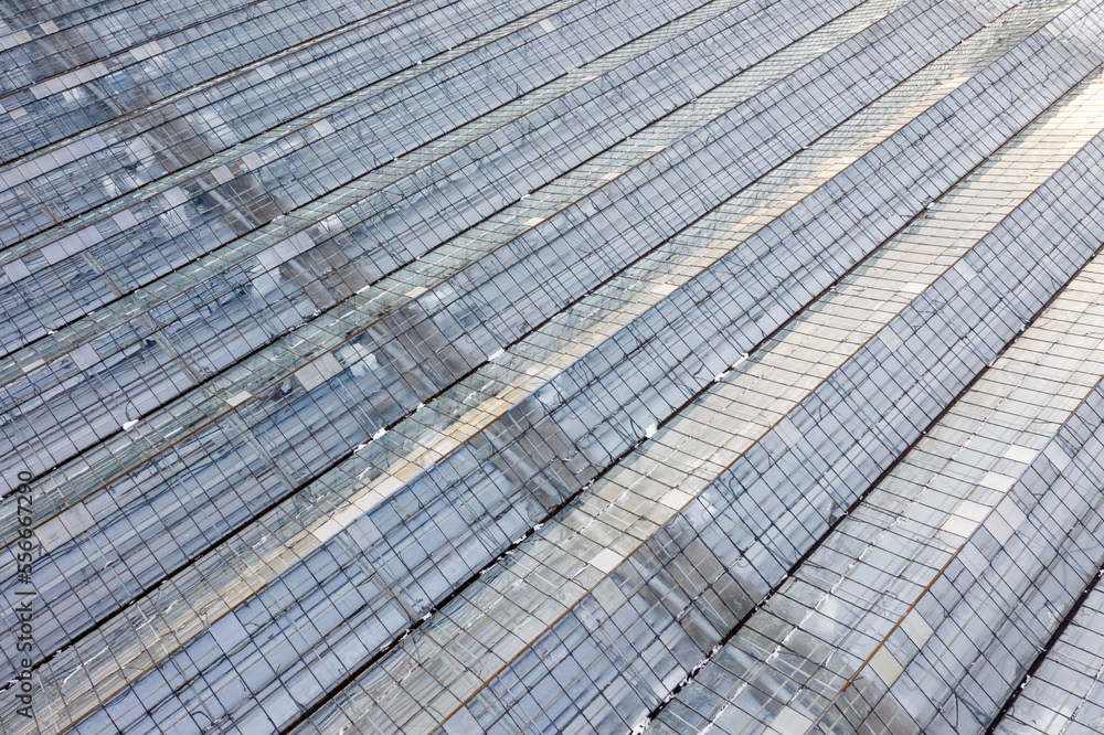 Fototapeta premium Greenhouse farm in winter top view.