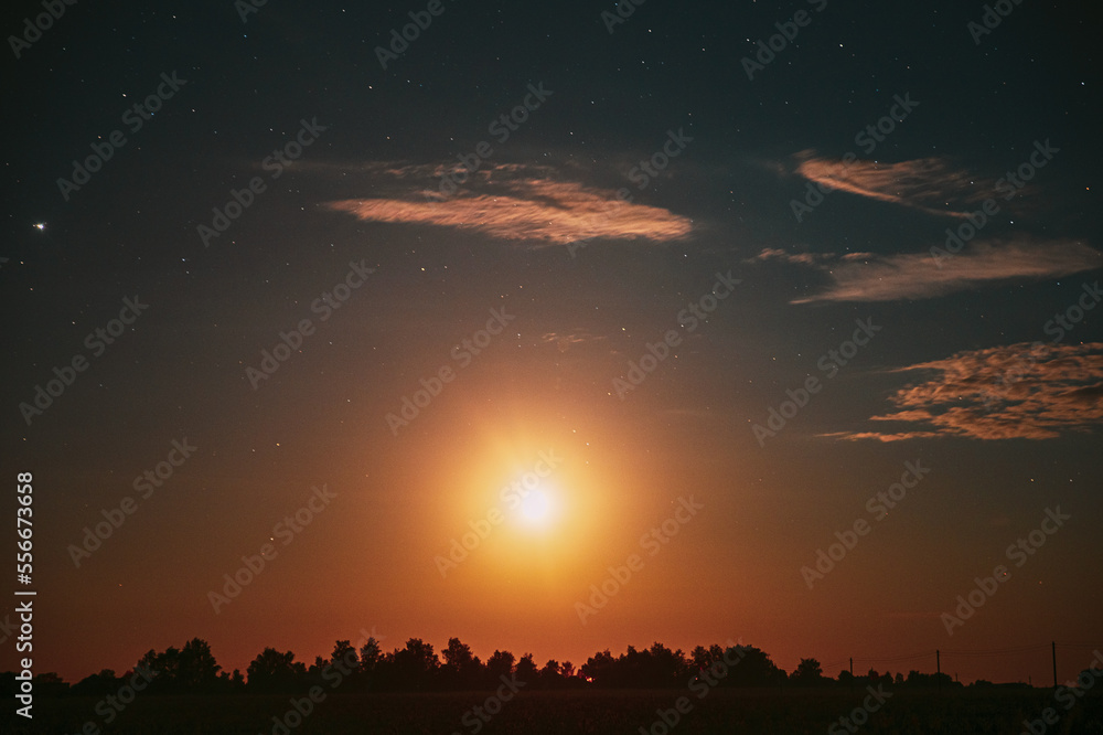 Moonrise Above Summer Forest park. Night Countryside Summer Starry Night Sky landscape.
