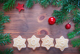 New Year background with decorations and 2023 cookies on wooden board
