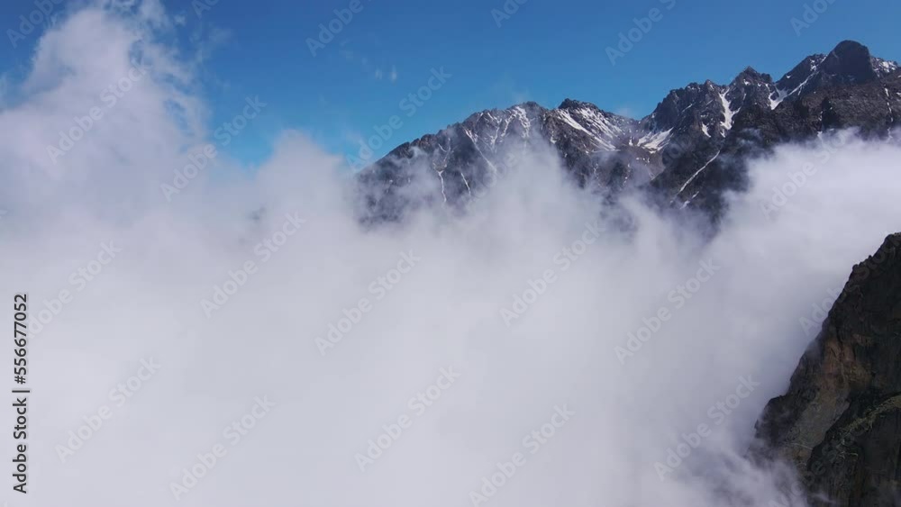 Fantastic mountain scenery of snow-covered alpine peaks Aerial view Timelapse Fantastic mountain scenery of snow-covered alpine peaks Aerial view Timelapse