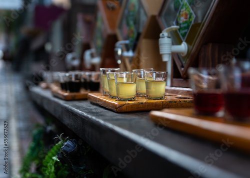Assortment of hard strong alcoholic drinks and spirits in glasses on bar counter