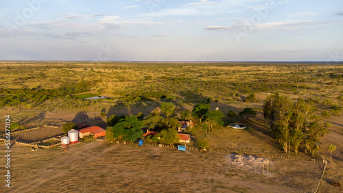 Aerial view of a typical Argentinian ranch house at sunset