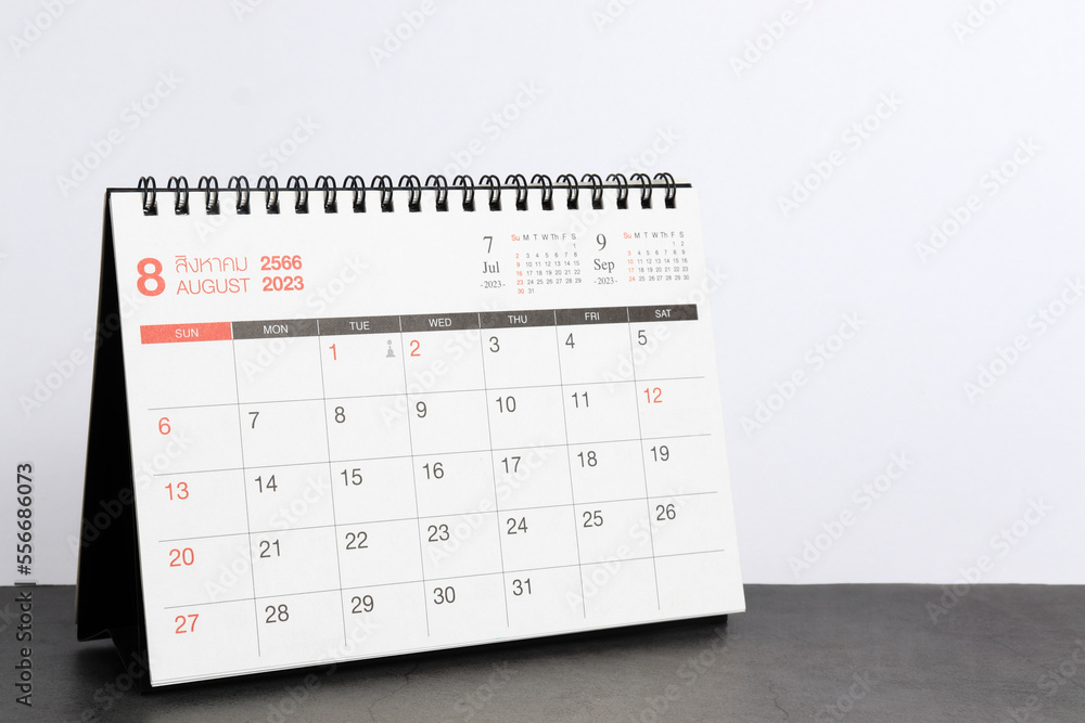 month August 2023 desk calendar for planners and reminders on a black table on a white background.
month August 2023 desk calendar for planners and reminders on a black table on a white background.