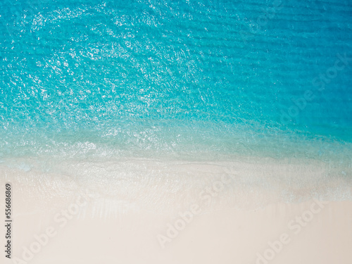 Paradise beach with white sand and blue ocean. Aerial view of holidays beach on Hawaii island