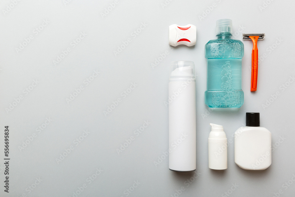 Composition with bath cosmetics on table. razor, toothpaste, soap, gel, toothbrush, mouthwash and other various accessories. Cosmetics for skin health. Bath Mockup for your logo Composition with bath cosmetics on table. razor, toothpaste, soap, gel, toothbrush, mouthwash and other various accessories. Cosmetics for skin health. Bath Mockup for your logo
