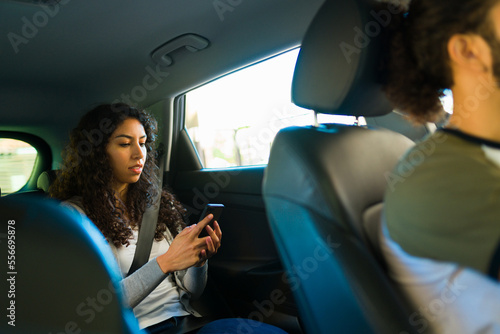 Young woman on a rideshare service car