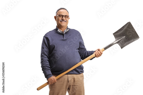 Mature man in casual clothes holding a shovel