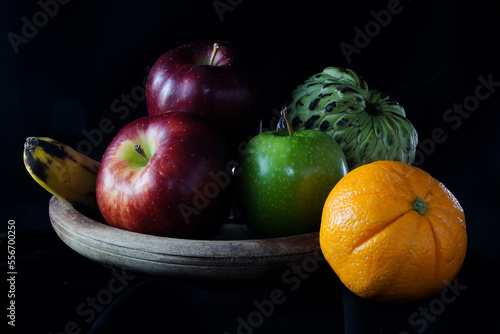 still life with fruits. apple, orange, srikaya photo