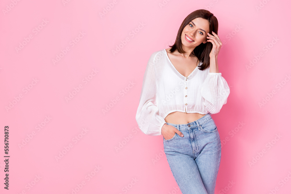 Photo portrait of pretty young girl fix hair defile posing spring collection wear trendy white outfit isolated on pink color background Photo portrait of pretty young girl fix hair defile posing spring collection wear trendy white outfit isolated on pink color background